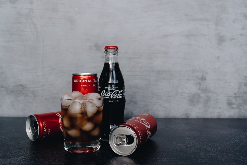 Soft drink cola in a branded cup with ice
